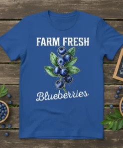 Farm Fresh Blueberries text with a watercolor illustration of blueberries and leaves on a blue t-shirt