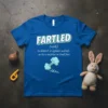 Blue t-shirt with "FARTLED (verb) to disturb or agitate sudenly as by a surprise or loud fart." definition and cartoon
