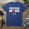 Blue t-shirt with white "FASTING MODE" text and a red circle with crossed-out fork and knife graphic