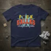 Navy blue t-shirt with bold yellow and orange text saying "F*CK DALLAS I'D LIKE TO BUY A VOWEL" in a