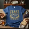 Blue t-shirt with gold "FEAST Mode" text and cornucopia graphic, perfect for Thanksgiving