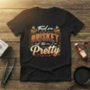 Feed me Brisket and tell me I'm Pretty text design with barbecue grills and flames graphic on a black t-shirt