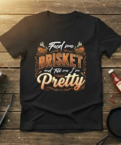 Feed me Brisket and tell me I'm Pretty text design with barbecue grills and flames graphic on a black t-shirt