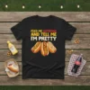 Feed Me Hotdogs And Tell Me I'm Pretty quote on a black t-shirt with illustrations of three hot dogs