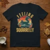 Feeling Squirrelly retro t-shirt design with a teal squirrel holding an acorn and vintage sunset stripes