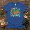 Retro groovy "Field Trip Squad" text with mountains and flowers on a blue t-shirt