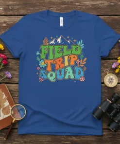 Retro groovy "Field Trip Squad" text with mountains and flowers on a blue t-shirt