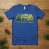 Fir Dogwood Tamarack text with watercolor forest trees design on blue t-shirt