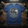 Opossum wearing leaves and the text "First Of All I'm A Delight" on a blue t-shirt