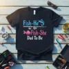 Fish-He Or Fish-She Dad To Be t-shirt with fishing theme, featuring fish graphics and text about an expectant father