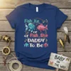 Fish He or Fish She DADDY To Be t-shirt design with blue and pink fish, fishing rod, and dots