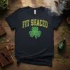 Navy t-shirt with green and gold "FIT SHACED" text and a Celtic shamrock graphic, perfect for St. Patrick's Day