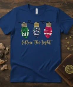 Follow The Light Christmas T-Shirt with a nativity scene inside three illuminated bulbs. Features Jesus' birth story in a religious