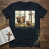 Christian t-shirt with "Follow The Word, Not The Herd" text and Highland cows beside a cross, referencing Isaiah 8:11-13