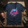 FOOTBALL GAME DAY text with a stylized football and pink and blue splatter design on a navy t-shirt