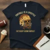 Football is a lifestyle eat sleep score repeat text and helmet graphic on a navy t-shirt