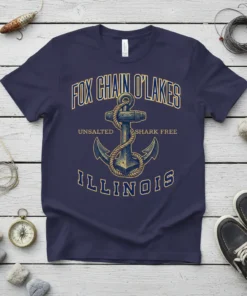 Navy t-shirt featuring "Fox Chain O'Lakes Unsalted Shark Free Illinois" text with an anchor graphic