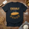 Freshly Baked t-shirt design featuring text and a steaming loaf of bread, perfect for bakers