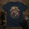 Fueled By Caffeine + Rage! t-shirt design featuring an angry raccoon holding a skull mug surrounded by flames