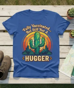 Blue t-shirt with "Fully Vaccinated But Still Not A Hugger" text and a cactus graphic