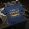 T-shirt with the text "I'm Not a Gynecologist But I'll Take a Look" in a vintage, golden style, featuring tools