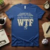 Blue t-shirt with "After Monday And Tuesday Even The Calendar Says WTF ?" text in vintage font, featuring a calendar