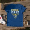 FÚTBOL IS LIFE text design with soccer ball graphic on a blue t-shirt