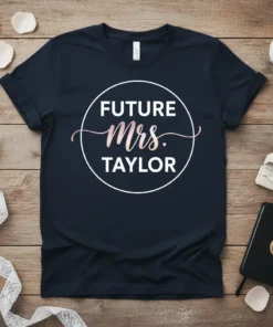 Future Mrs. Taylor text design in a circle with rose gold Mrs. script on a navy t-shirt