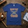 Blue t-shirt with "GAME DAY VIBES" text in neon yellow and a baseball with crossed bats graphic