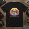 GAMESOLOTL text on a black t-shirt with a cute axolotl wearing headphones and playing video games, retro sunset graphic