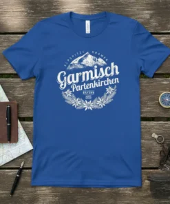 Garmisch Partenkirchen Bayern Alpspitze Kramer T-Shirt with mountain graphic and floral wreath, white text on blue tee