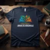 Gary Byker LIBRARY OF HUDSONVILLE t-shirt with colorful open book graphic and white text