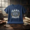 Gary The Man The Myth The Legend text design on a navy blue t-shirt, featuring vintage laurel wreath and shield