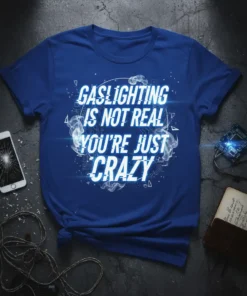 Gaslighting Is Not Real You're Just Crazy quote in bold white font on a blue t-shirt, surrounded by digital circuit