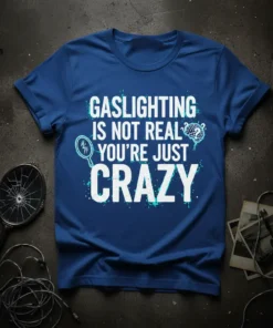 Gaslighting Is Not Real You're Just Crazy quote on a blue t-shirt, featuring a magnifying glass and brain graphic