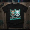 Gaslighting isn't real you crazy bitch quote on black t-shirt with cyber cat graphics, neon blue outline, futuristic style