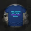 Gaslighting Isn't Real You're Just Crazy quote t-shirt with glitch effect text in blue and purple on a navy shirt