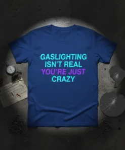 Gaslighting Isn't Real You're Just Crazy quote t-shirt with glitch effect text in blue and purple on a navy shirt
