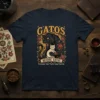 T-shirt featuring the Spanish phrase "Gatos Before Vatos Unless the Vato Has Gatos" with a black panther and a white