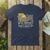 Georgia is calling and I must go quote on a navy blue t-shirt with a gold map outline and compass