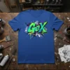 Gex graffiti logo design with vibrant green and blue colors on a blue t-shirt, urban streetwear style