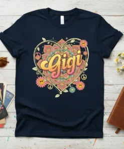 Navy t-shirt featuring the word "Gigi" in a retro font within a colorful heart mandala, surrounded by flowers and peace