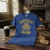 Blue t-shirt with "Ginger Pride" text and a Celtic knot shamrock graphic in gold
