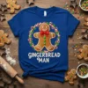 Blue t-shirt with a gingerbread man graphic and the text "GINGERBREAD MAN" in white, surrounded by a candy cane and