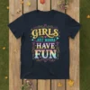 Girls Just Wanna Have Fun text design with retro typography and colorful accents on a navy t-shirt