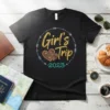 Girl's Trip 2023 text with tribal hearts and arrows on a black t-shirt, perfect for vacation squad matching outfits