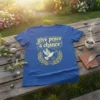 Blue t-shirt with "give peace a chance" text and a dove holding an olive branch with the Earth graphic, surrounded