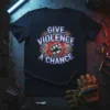 Black t-shirt with "GIVE VIOLENCE A CHANCE" text and a raised fist graphic, featuring cracked texture and red/blue accents
