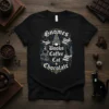 Gnomes Books Coffee Cat Chocolate text design with gnome, books, coffee cup, and cat graphics on a black t-shirt