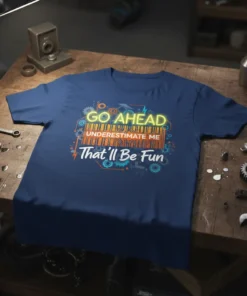 Navy blue t-shirt with "GO AHEAD UNDERESTIMATE ME That'll Be Fun" text and gears graphic